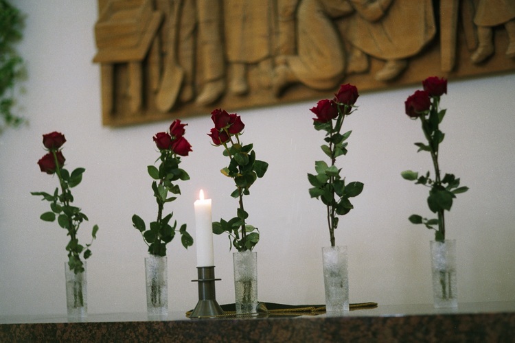 Red roses on a church altar.
