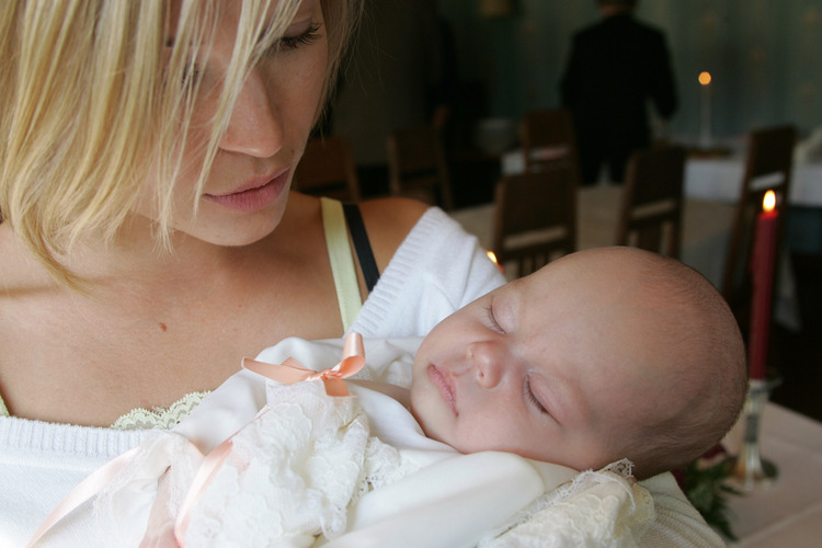 A baby and a godparent.