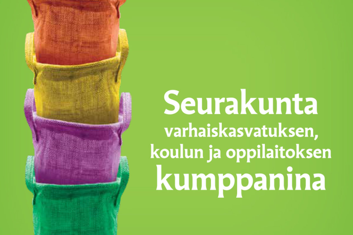 Neljä eriväristä koria päällekkäin ja teksti