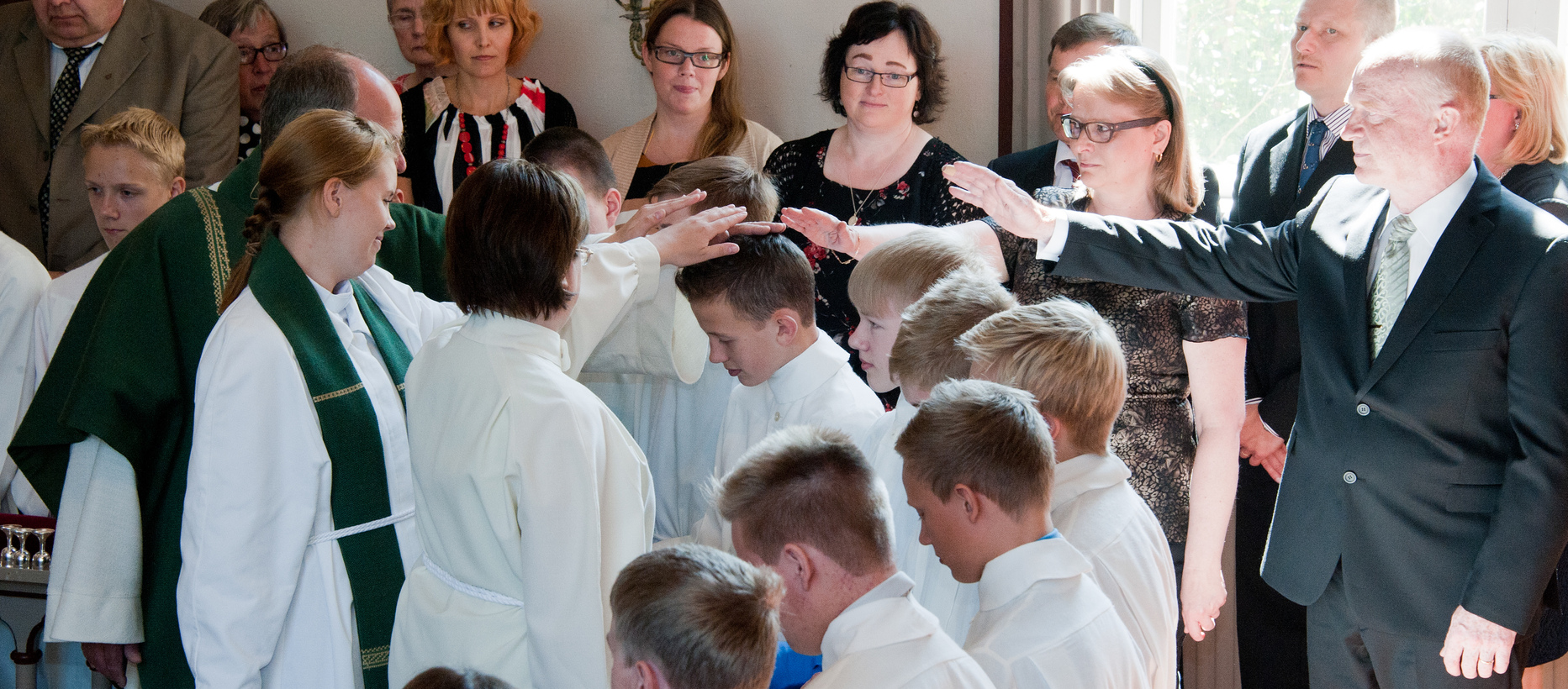 Blessing youngsters in confirmation.