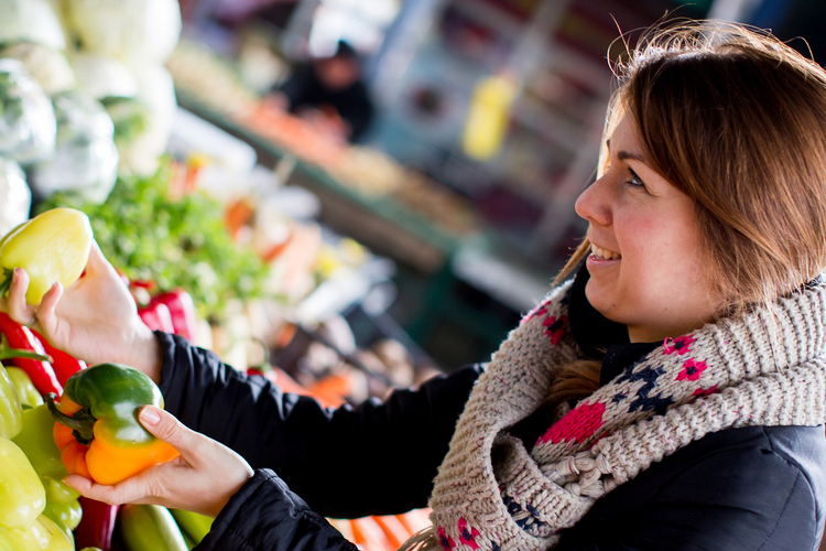 A woman selling vegetables.