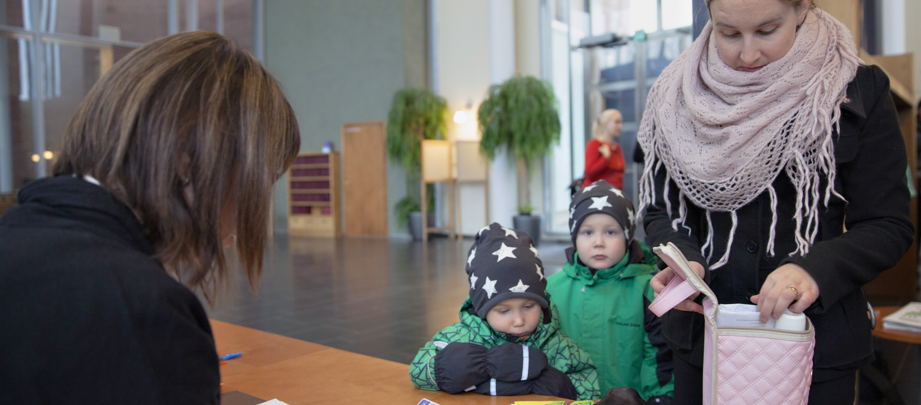 A woman with children at the church office.