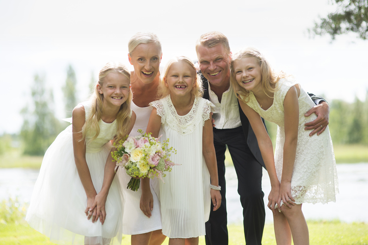 Wedding couple with flower girls.