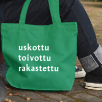 Vihreä kassi, jossa lukee uskottu toibottu rakastettu